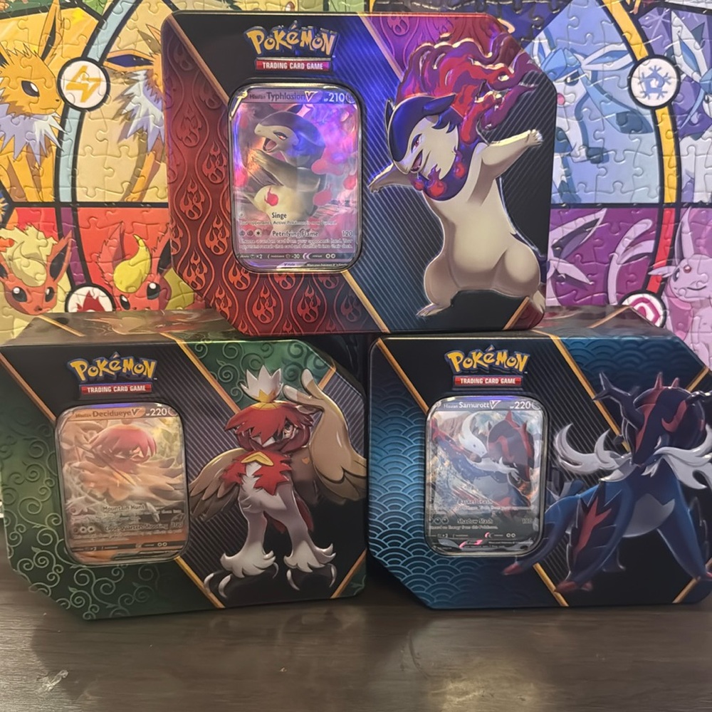 Pokémon larger tins (3) with cards shown